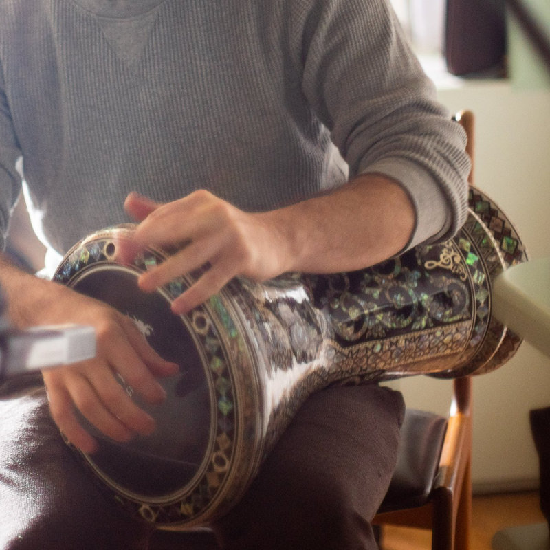 Hands on a darbuka